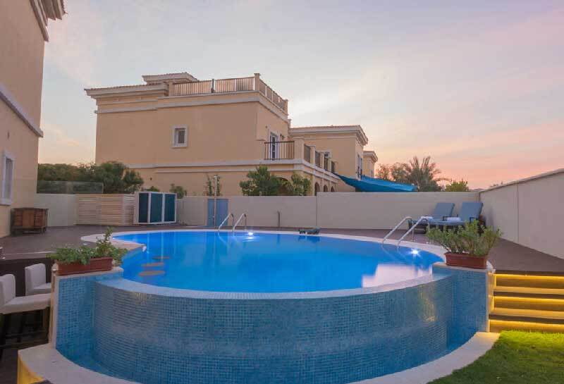 Unique swimming pool design with a mini-pool bar constructed by Silver Fox